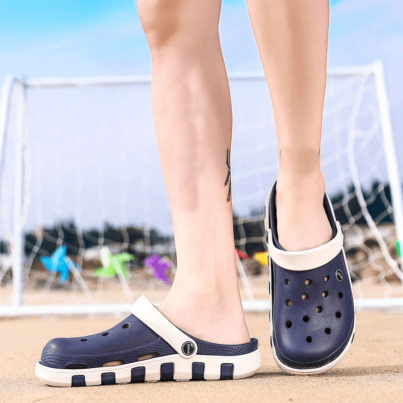 Person wearing beach lightweight quick-drying sandals with anti-slip soles in navy, ideal for summer activities by the shore.
