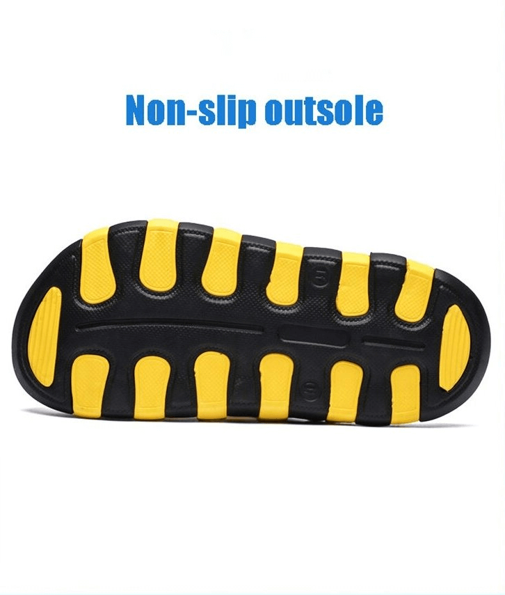 Close-up of a non-slip outsole of beach quick-drying sandals in black and yellow, highlighting superior grip and safety features.