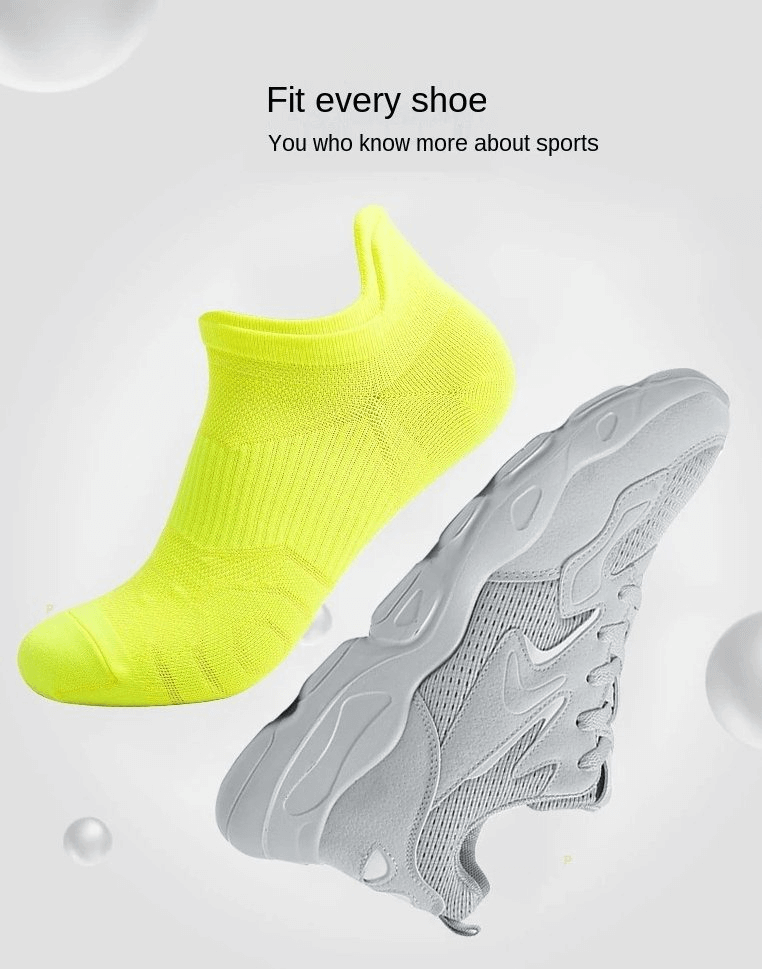 Neon yellow breathable anti-slip sports sock beside a sleek grey sneaker, showcasing unisex design and lightweight comfort for active sports.