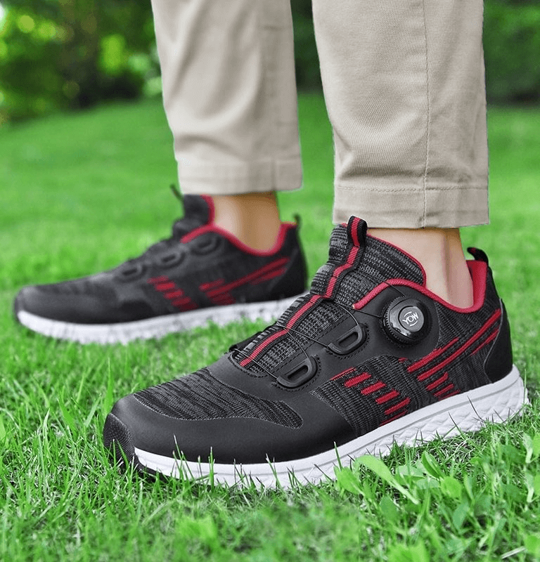 Breathable Flexible Casual Lace Up Sneakers in black and red on grass, showcasing comfort and style for everyday wear.