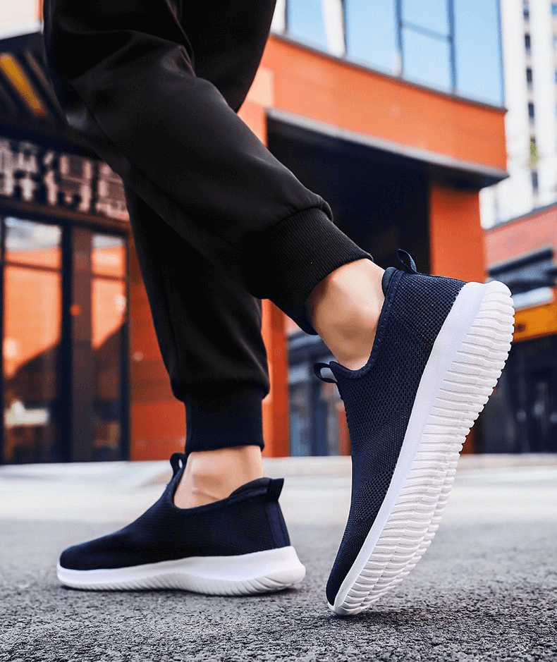 Breathable Flexible Elastic Casual Sneakers SF0745 in action, showcasing comfort and style for men and women, worn outdoors.