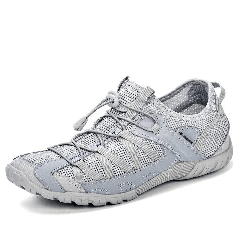 Breathable mesh flexible men's sneaker in gray with elastic band closure for sports and adventure.
