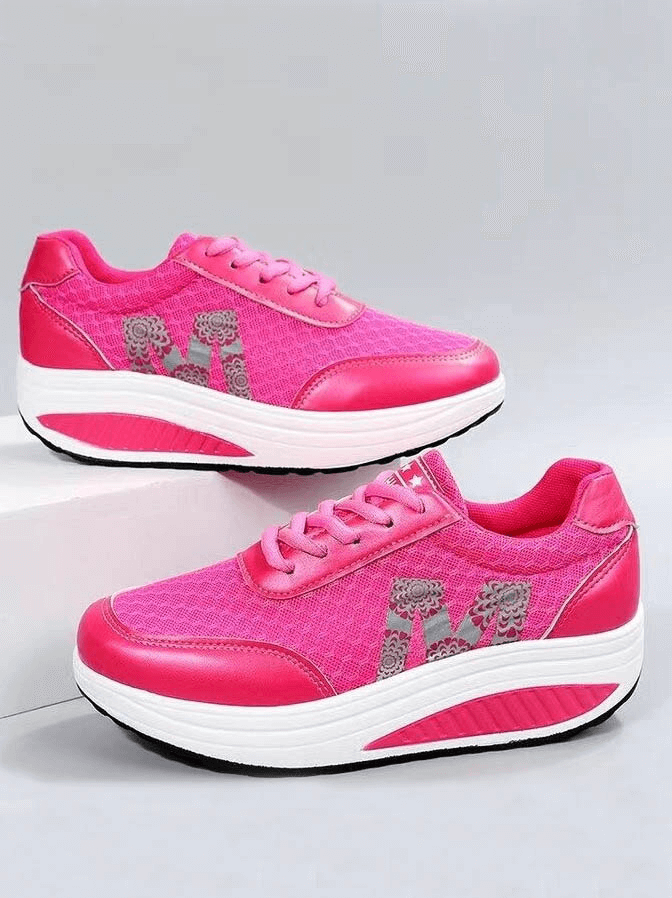 Vibrant pink breathable mesh sneakers with thick bottom and lace-up design for casual comfort and style.