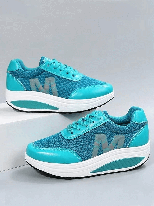 Turquoise breathable mesh thick-bottom sneakers with lace-up design and white soles, perfect for casual style and comfort.