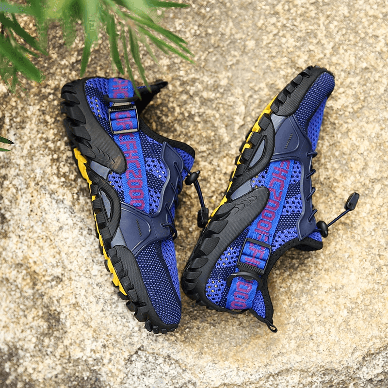 Blue breathable mesh trekking shoes with yellow soles, unisex sports sneakers perfect for outdoor adventures.