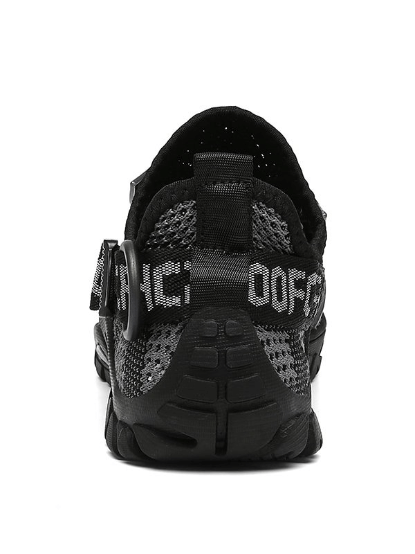 Rear view of black breathable mesh trekking shoe with elastic band closure, perfect for outdoor adventures and unisex sports wear.