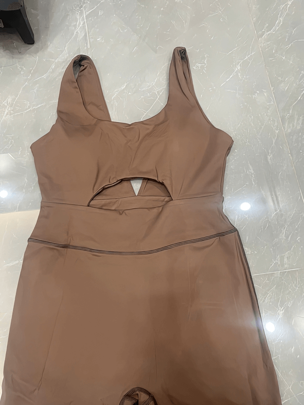 Brown breathable quick dry V-back sleeveless yoga jumpsuit for women, designed for comfort and flexibility in workouts.