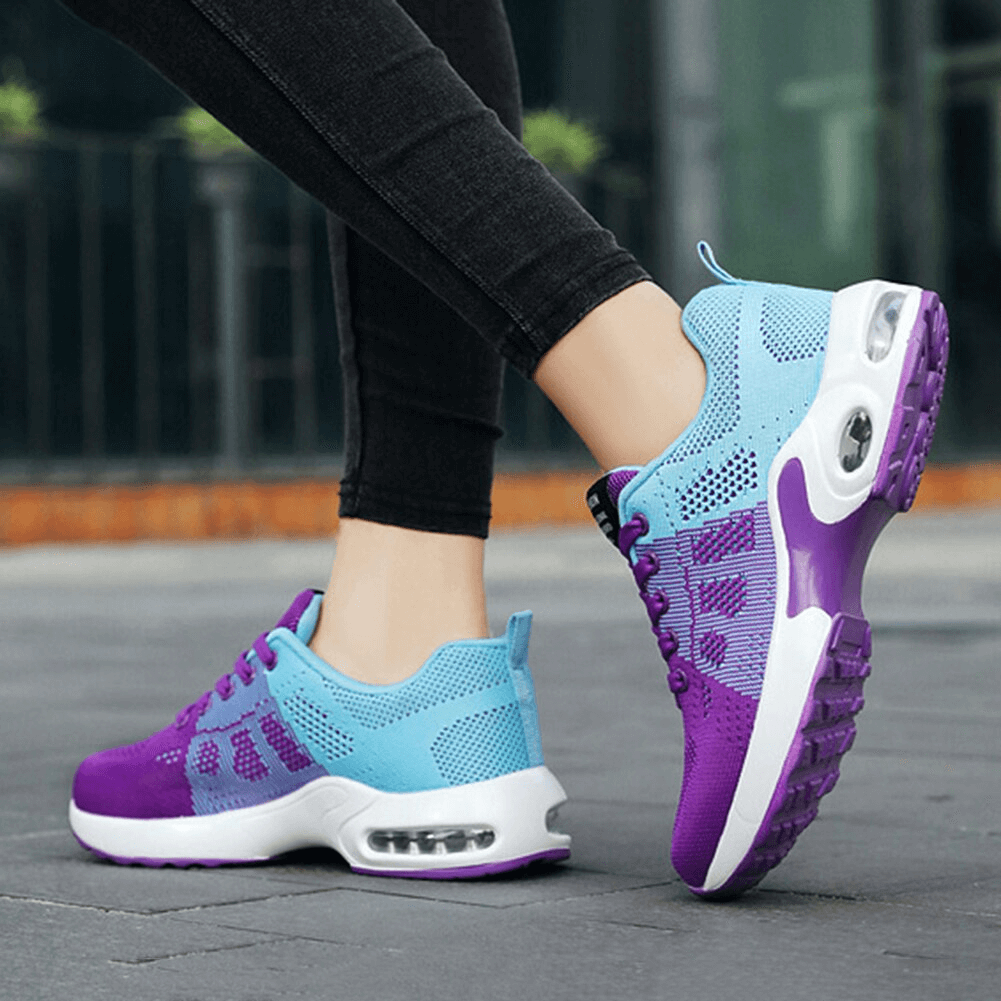 Vibrant purple and blue breathable lace-up running shoes for comfortable jogging