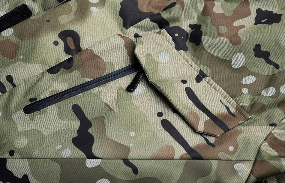 Close-up of camouflage waterproof men's snowboard jacket with pocket details and durable fabric.