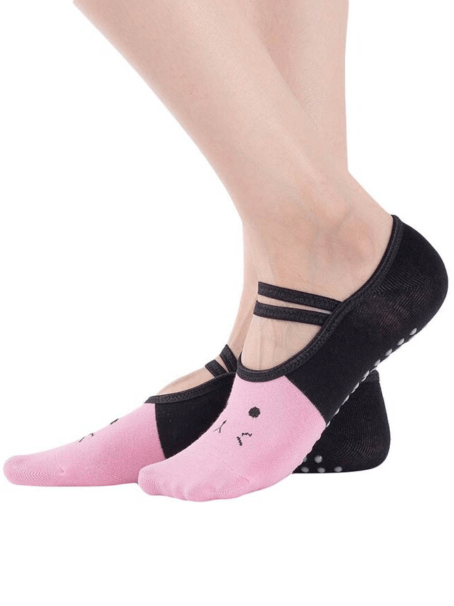 Cartoon Cat Print Anti-Slip Yoga Pilates Socks in pink and black, offering comfort and grip for women during workouts.