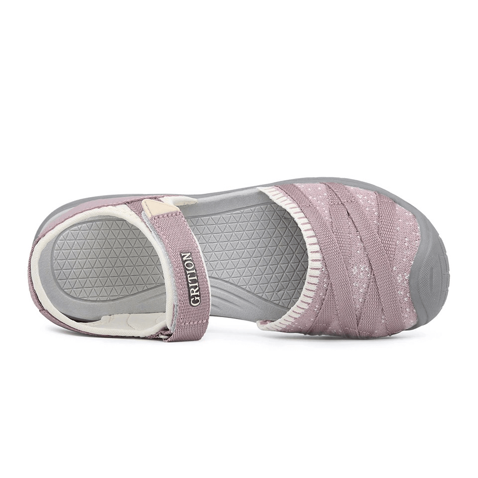 Top view of a mauve trekking sandal for women, featuring closed toe, EVA insole, and hook & loop closure. Ideal for walking and traveling.