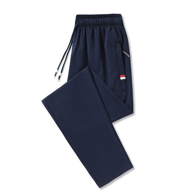 Navy blue men's cotton sweatpants with elastic waist and pockets, featuring a drawstring closure for a comfortable fit.