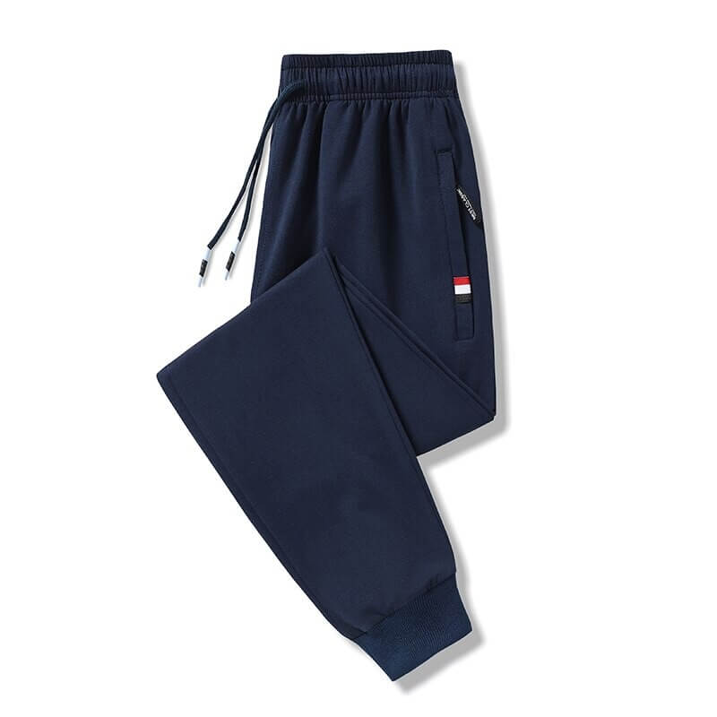 Navy casual cotton sweatpants for men with elastic waist and pockets, featuring a drawstring closure and fleece material for warmth.