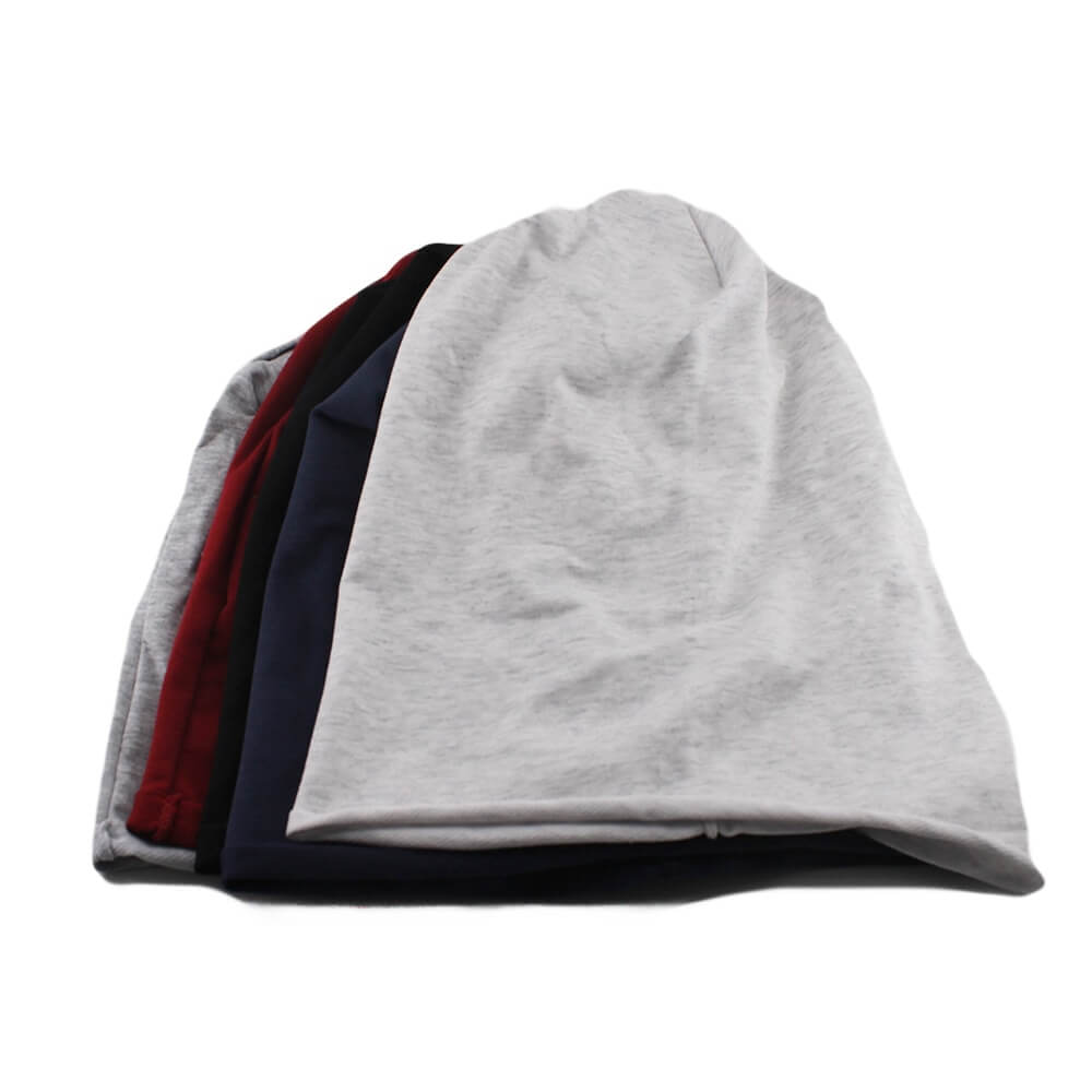 Collection of casual cotton beanies in solid colors, perfect for men and women, made from soft cotton blend for comfort and warmth.