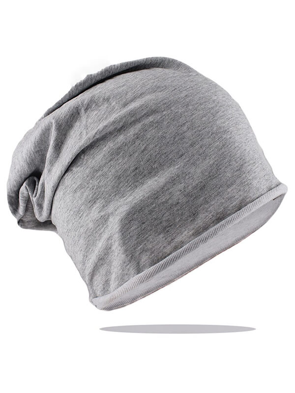 Casual cotton soft solid beanie, unisex gray knit hat for cold weather. Comfortable, stylish accessory for men and women.