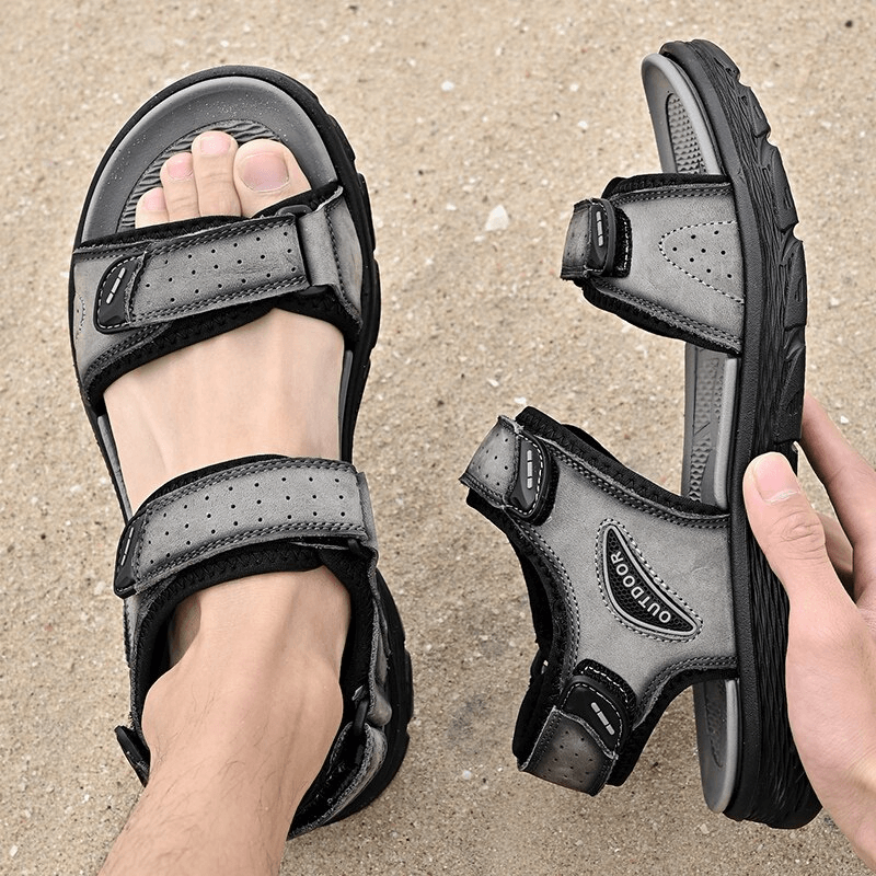 Gray and black genuine leather hiking sandals with soft soles, shown on a sandy beach, perfect for outdoor adventures - SF0777