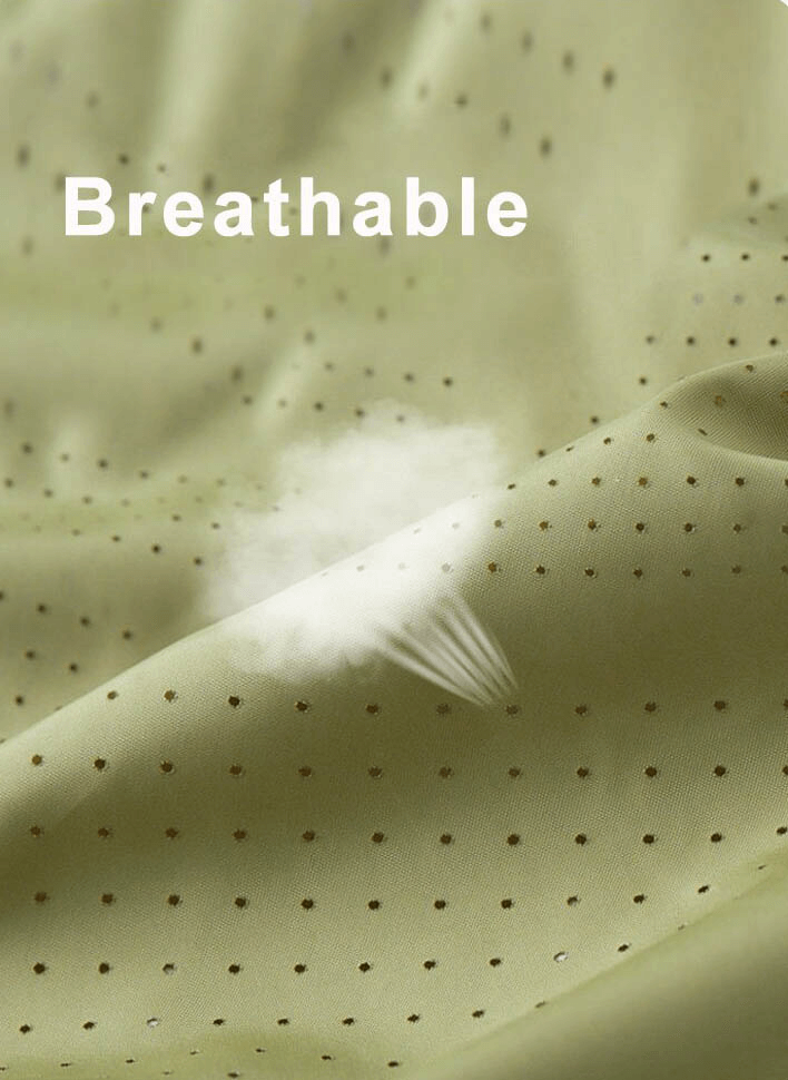 Breathable perforated fabric close-up, showcasing lightweight and airy material for summer wear.