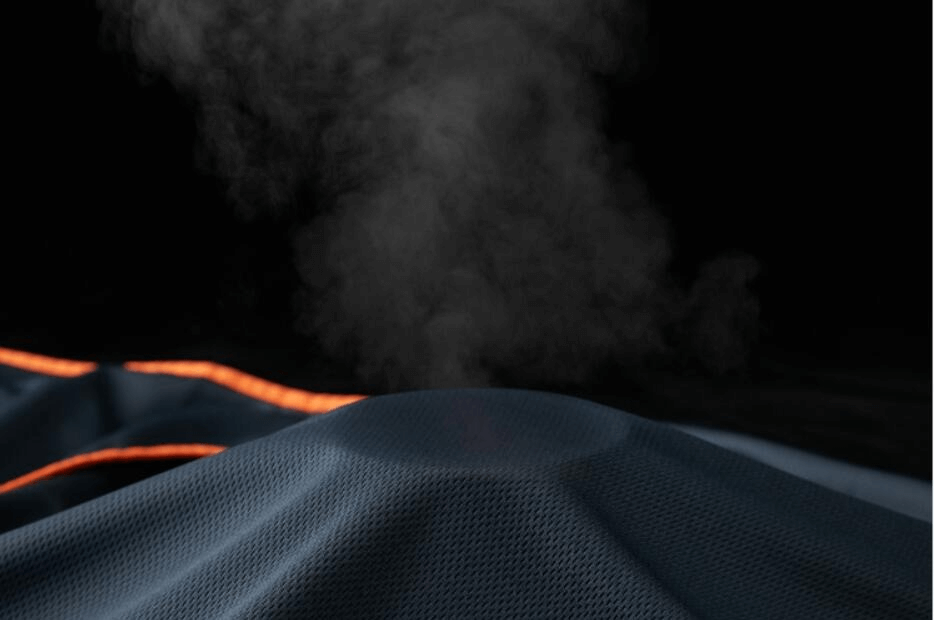 Close-up of breathable fabric texture with steam, highlighting the lightweight, thin sunscreen jacket material.
