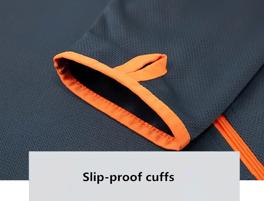 Close-up of slip-proof cuffs on a casual lightweight, thin sunscreen jacket for men, featuring an orange and dark fabric design.