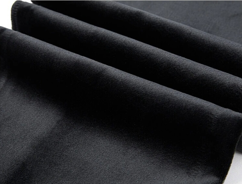 Close-up of Casual Men's Thick Pants fabric, showcasing windproof and warm polyester-cotton blend in black.