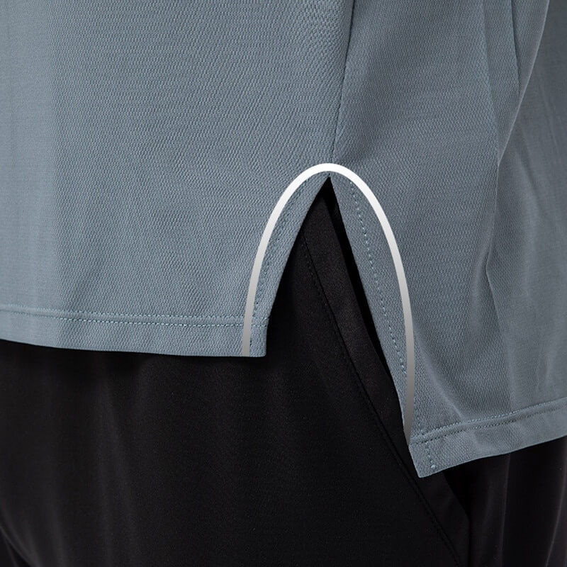 Close-up of a men's basketball tank top in breathable mesh fabric, highlighting o-neck and side slit for easy movement.