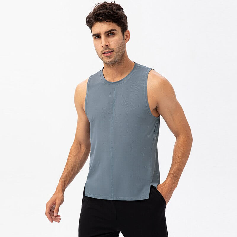 Model wearing casual O-neck mesh tank top for men's basketball in SF0604. Breathable polyester fabric for high-intensity workouts.
