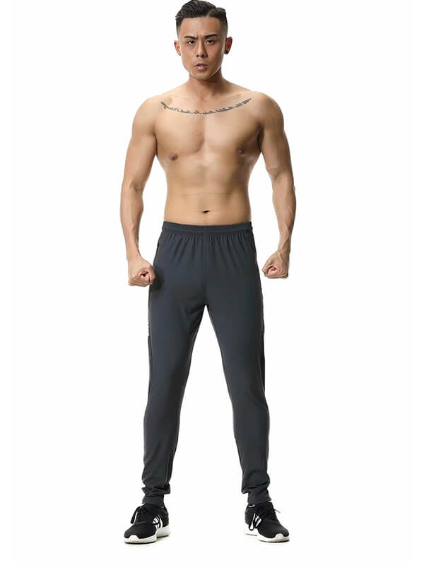 Men's casual running joggers with zipper pockets in dark gray, featuring lightweight polyester fabric and elastic waistband.