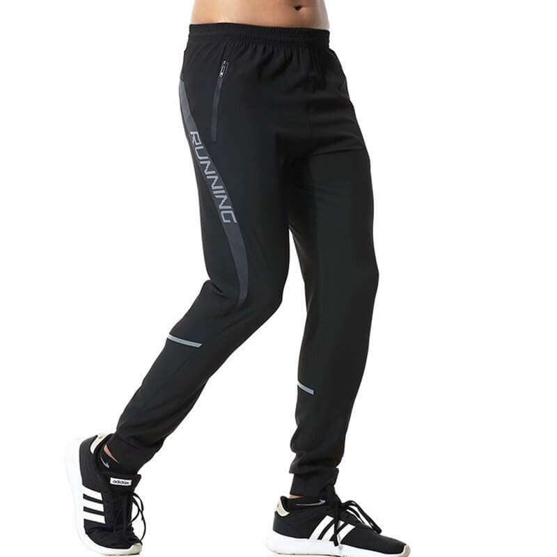Men's casual running joggers in black with zipper pockets and elastic waistband, designed for optimal comfort and fit.