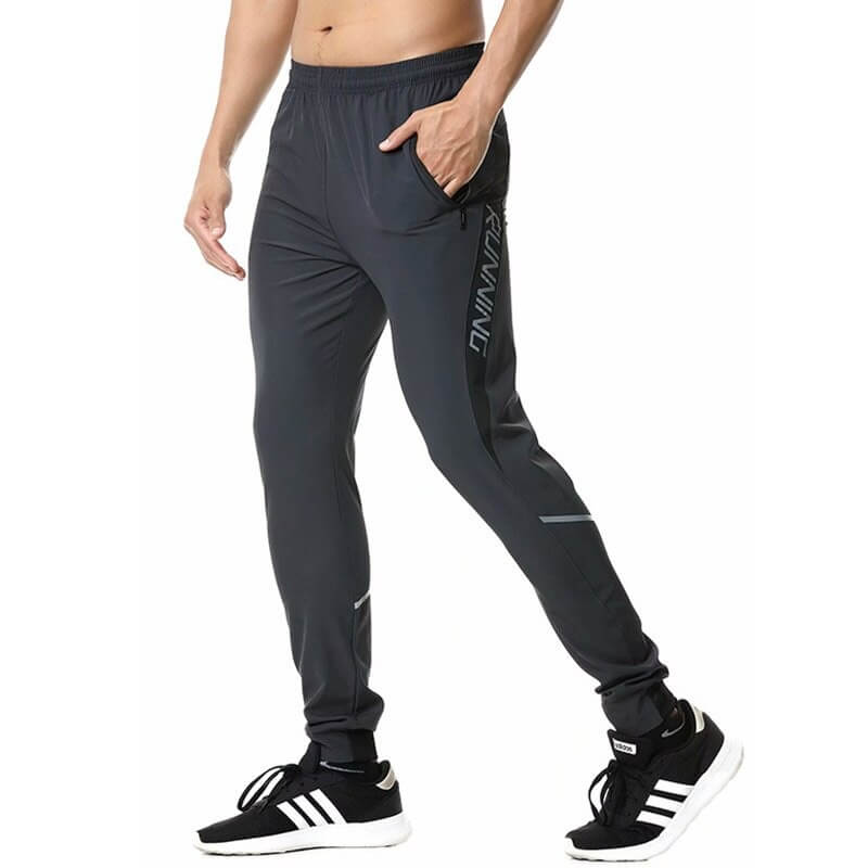 Men's casual running joggers with zipper pockets in gray, featuring an elastic waistband and lightweight polyester fabric for comfort.