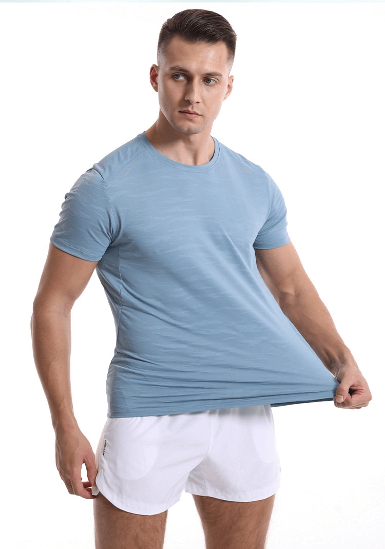 Man wearing a blue short sleeve basketball elastic T-shirt, SF1043, showcasing its fit and comfort for active sports.