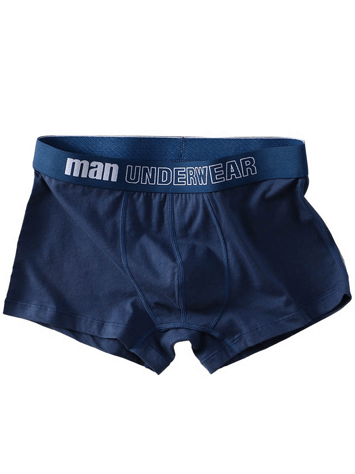 Dark blue cotton men's boxer shorts with 'man underwear' waistband.