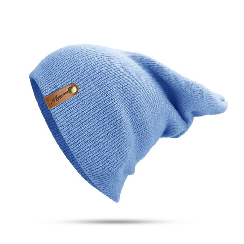 Soft blue knitted beanie with solid color design for cozy winter wear, unisex fit, cotton material, warm casual style.