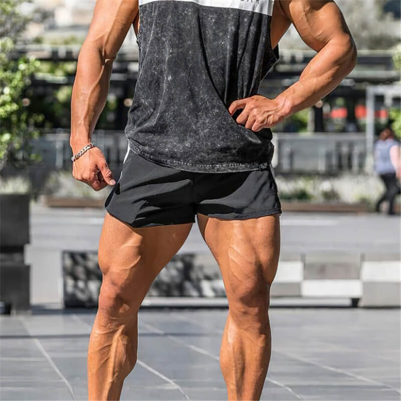 Man wearing Casual Training Drawstring Short Shorts in black, perfect for gym, running, and sports performance.