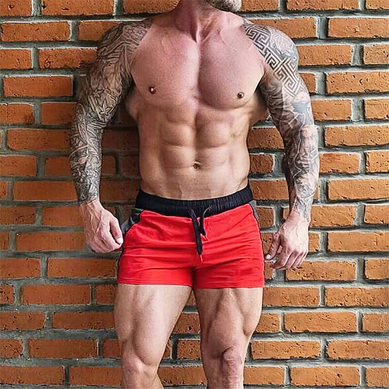 Casual red drawstring short shorts for men, perfect for gym, boxing, or running. Features a snug fit with a blend of polyester and spandex.