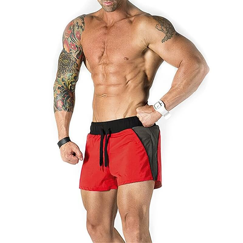 Model wearing red and black casual training drawstring short shorts for men, showcasing athletic fit and style for gym and sports activities.