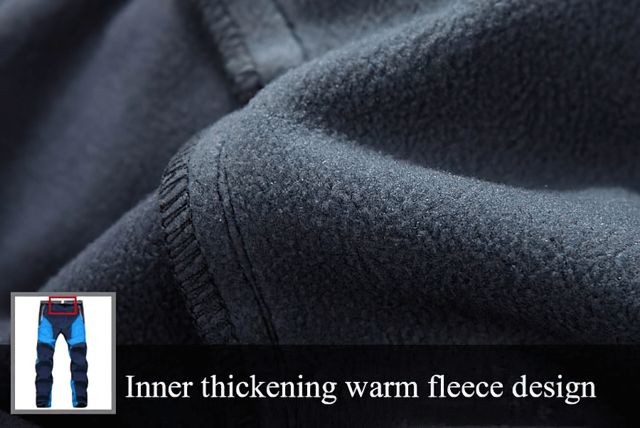 Close-up of warm fleece fabric in waterproof skiing outdoor pants, featuring inner thickening design for added warmth.