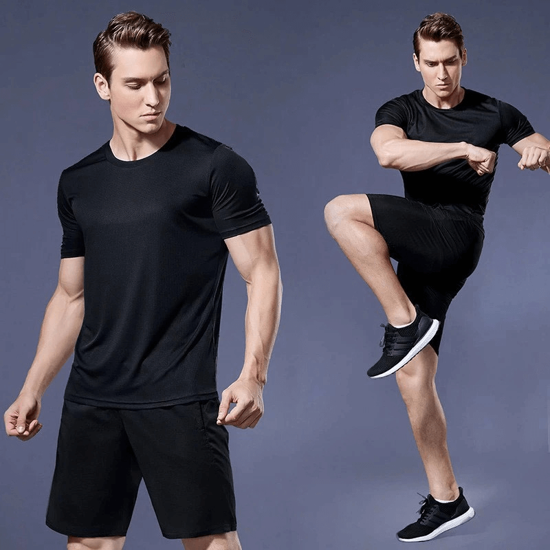 Compression men's running t-shirt, muscle fit, in action. Stylish, black quick-drying sportswear for active training.