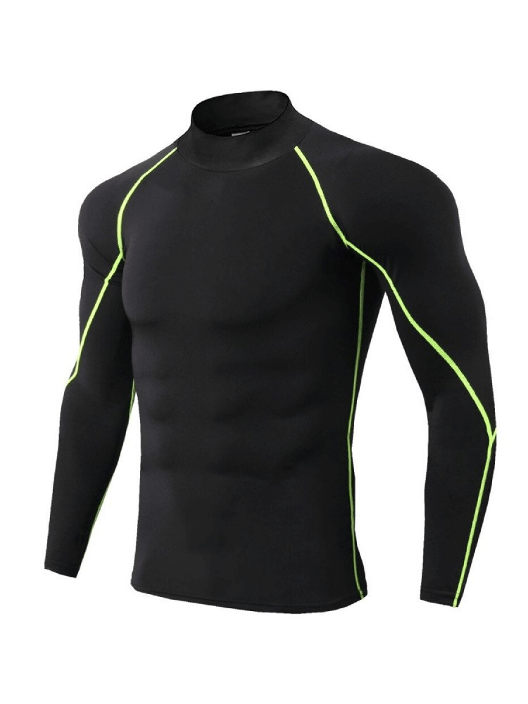 Men’s compression quick dry long sleeves t-shirt for running in black with neon green seams, made from breathable polyester.