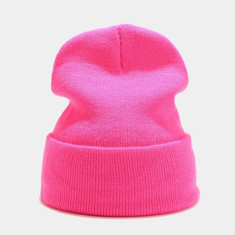 Bright pink knitted acrylic hat for men and women with a casual style, providing warmth and comfort. Unisex design perfect for all seasons.