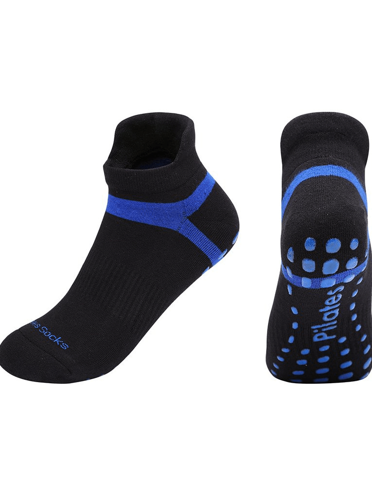 Cotton anti-slip compression women's socks for yoga training, black and blue with grip dots, ideal for professional sports.