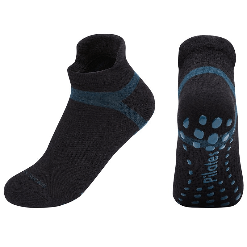 Black anti-slip compression socks for women, perfect for training and yoga, featuring ergonomic combed cotton design with grip.