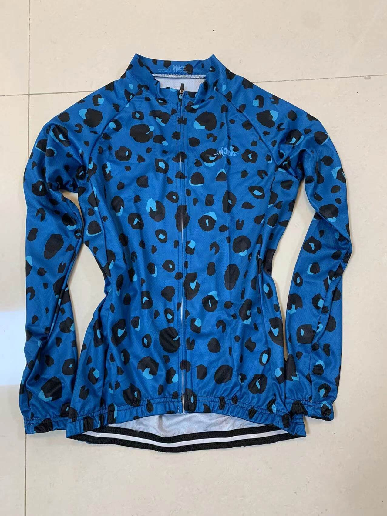 Blue leopard print cycling fleece jacket with full-length zipper for women, perfect for warmth and style in cold weather rides.