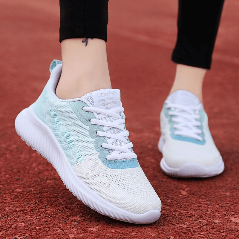 Doble Color Breathable Women's Running Shoes on track showcasing comfort, style, and performance.