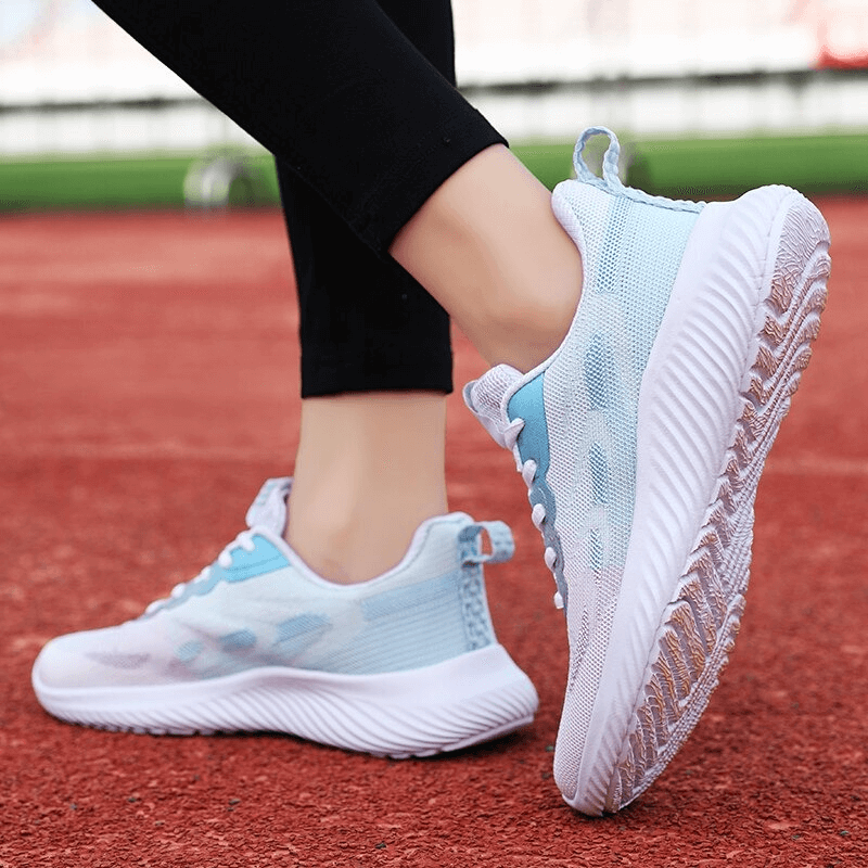 Women's Doble Color Breathable Running Shoes showcasing light blue design and durable EVA outsole, ideal for fitness and flexibility.