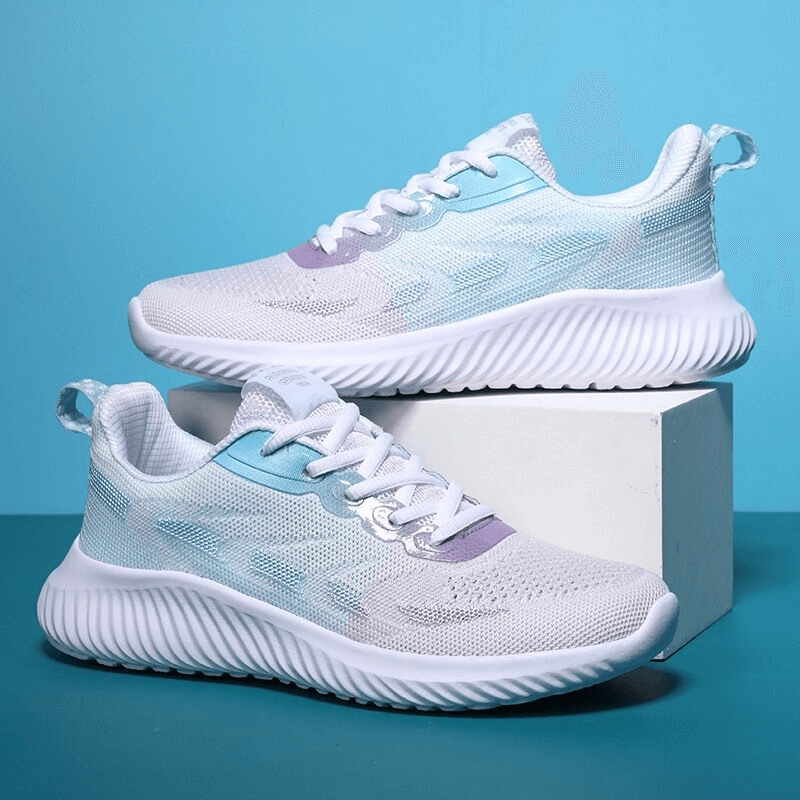 Women's Doble Color Breathable Running Shoes SF0254 with quick-drying mesh and EVA outsole, showcased on a pedestal.