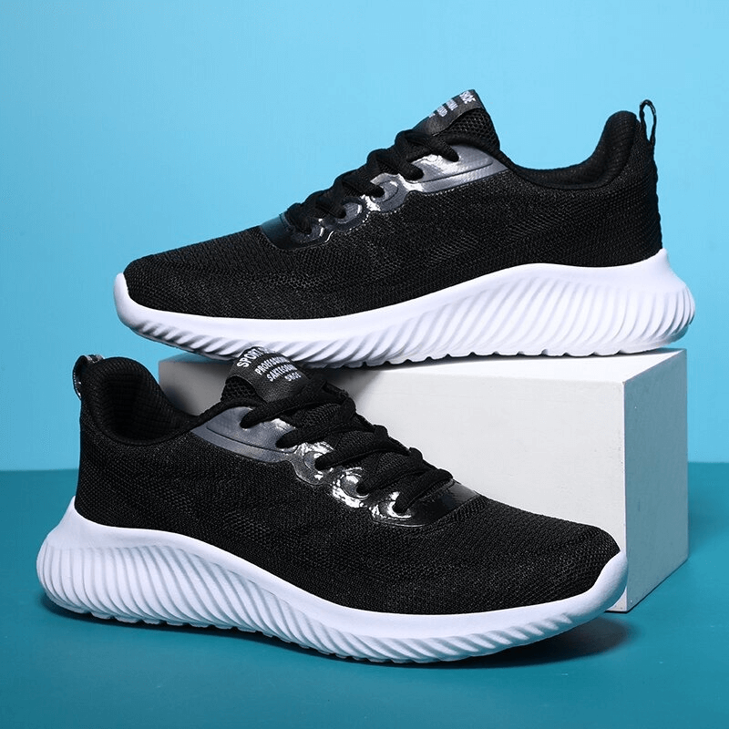 Doble Color Breathable Running Shoes for Women SF0254 with black mesh upper and white EVA outsole on a blue background