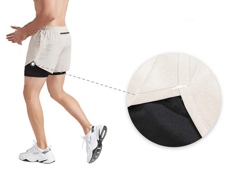 Man running in double-deck training shorts with pocket back and drawstring, designed for flexibility and performance in workouts.