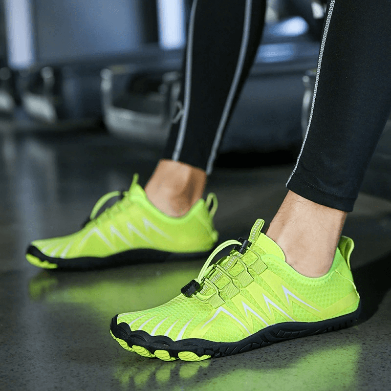 Person wearing neon green drainage antiskid sole sports breathable shoes for swimming, perfect for aquatic activities.