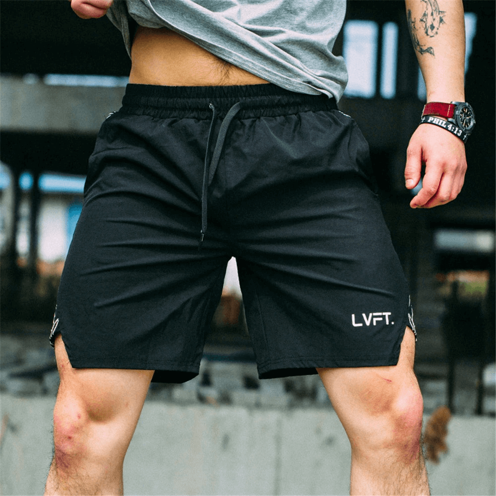 Solid color running shorts for men in action at the gym, quick-drying polyester, adjustable drawstring waistband, perfect for workouts.