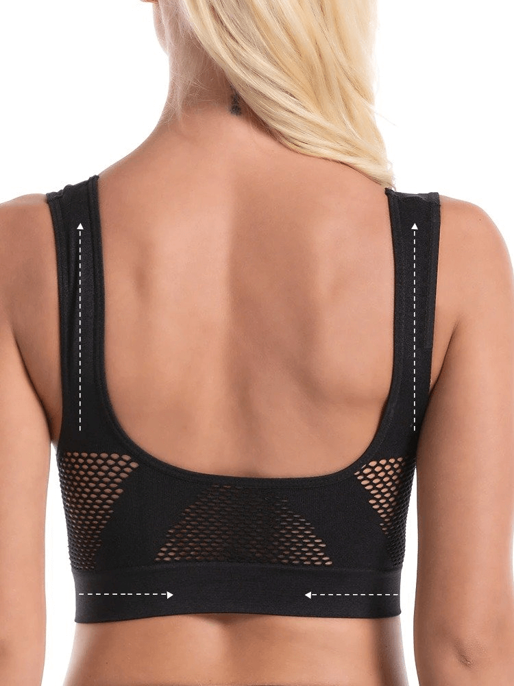 Back view of elastic breathable women's sports bra with holes, showing seamless and wire-free design in black. Model has blonde hair.